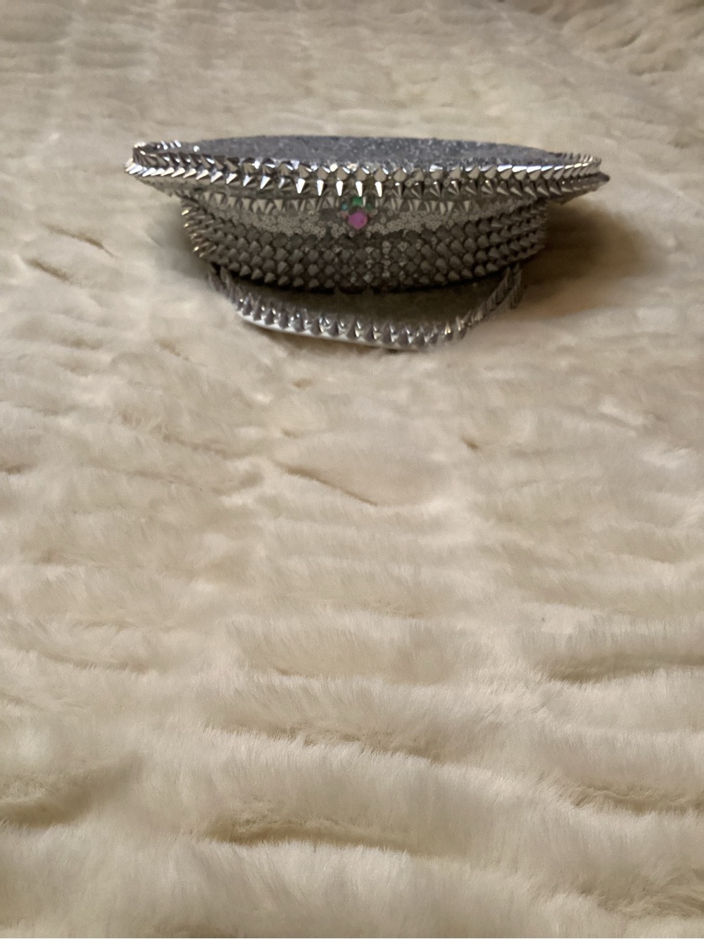 silver spiked captain's hat covered in metallic studs and rhinestones